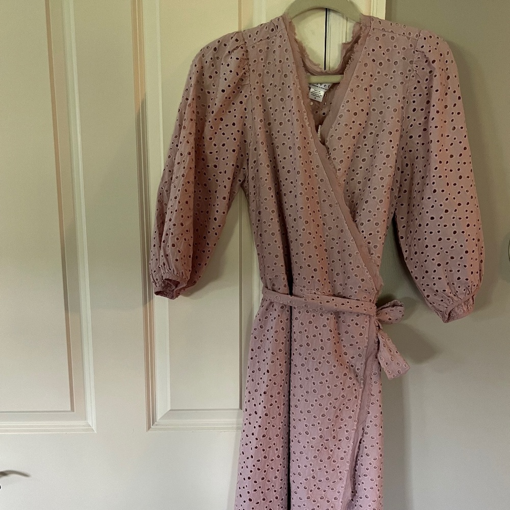 Pink Eyelet wrap dress brand is Velvet sold at Anthropologie